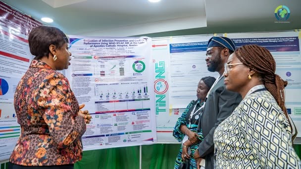 Public health researcher presenting an implementation science research poster and study findings during a scientific dissemination conference.